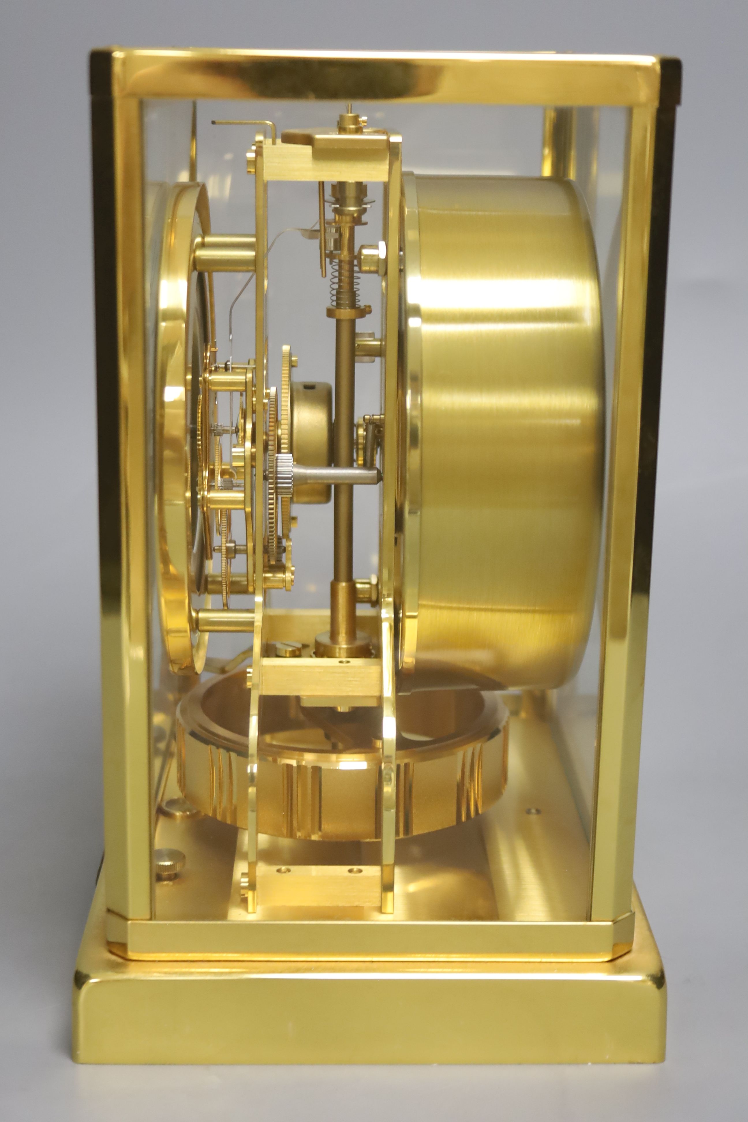 A Jaeger le Coultre Atmos mantel clock, with white enamelled Roman chapter ring, in gilt-brass panelled case, height 22.5cm